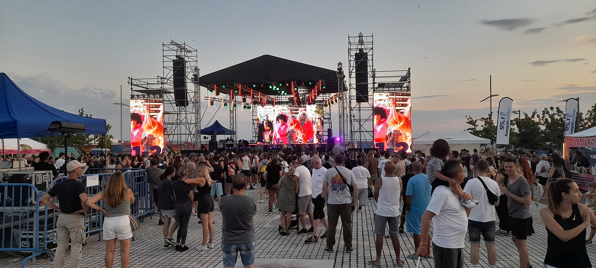 Real concert crowd facing a live stage